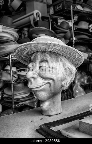 LOS ANGELES, CA - JULY 31, 2024: A model of a head similar to one used as a ventriloquist dummy is used in a hat factory to provide a shape on which t Stock Photo