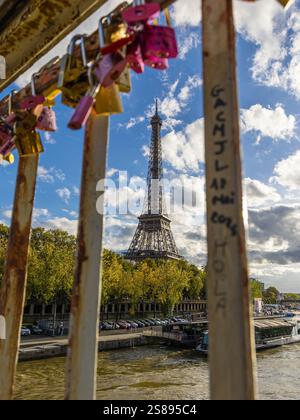 Eiffel Tower view from Parisian bridge with locks Stock Photo