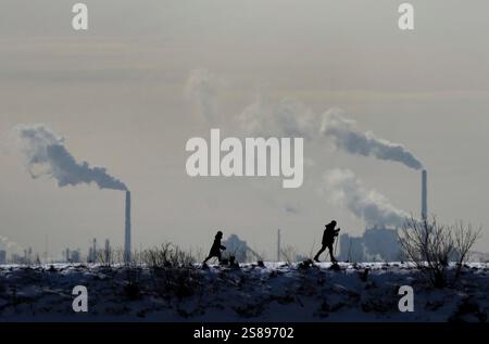 Toronto, Canada. 04th Feb, 2022. Environment Canada says most of Ontario is under prolonged extreme cold warnings, with wind chill values reaching -45 degrees in some areas. People cross-country ski in the cold weather as an industrial plant is shown in the back ground in Toronto on Friday, Feb. 4, 2022. Credit: The Canadian Press/Ģ����ý Live News Stock Photo