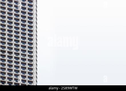 White skyscrapers of houses, with balconies, repeated in the form of a pattern, with copy space, white background Stock Photo