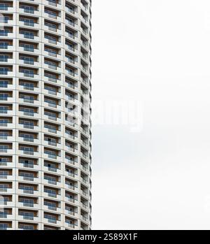 White skyscrapers of houses, with balconies, repeated in the form of a pattern, with copy space, white background Stock Photo