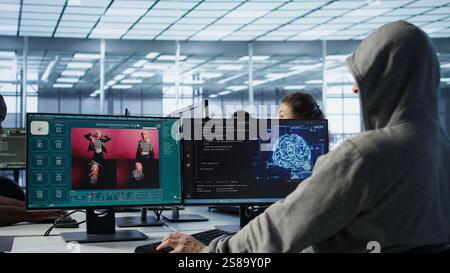 Admin in server hub coding AI program turning text prompt into photos. IT expert in data center using computer to build text to image artificial intelligence generative models, camera B Stock Photo