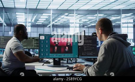 Engineer in server hub making AI software turning text prompt into photos. Technician in data center building text to image artificial intelligence generator transforming words into pictures, camera B Stock Photo