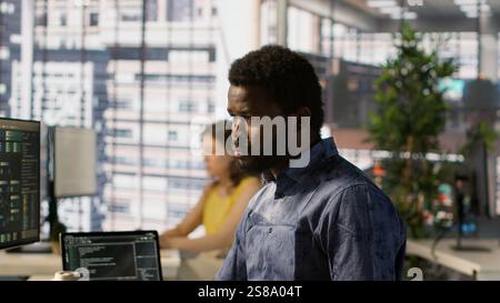 Data scientist developing and maintaining machine learning APIs solving complex problems. Man training predictive models capable of handling tasks such as language processing, camera A Stock Photo