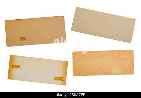 Set of four old rectangular cardboard paper with aged yellow stains isolated cutout on white Stock Photo