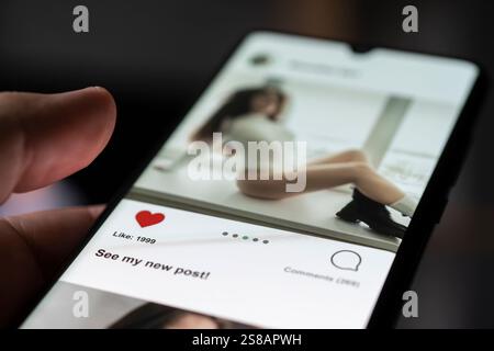 Man giving a like to photo on social media or swiping on online dating app. Finger pushing heart icon on screen in smartphone application. Friend, fol Stock Photo