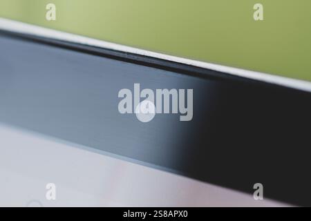 mobile camera lens on black background, macro view. the front camera of the smartphone. Stock Photo