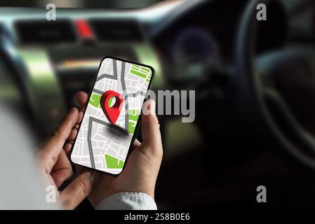gps map ,man using a smartphone displaying a map in a car gps navigation system Stock Photo