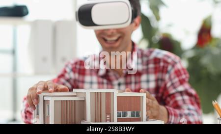 Architecture design drawings, building model on blueprint floor plan, house construction. 3d Stock Photo
