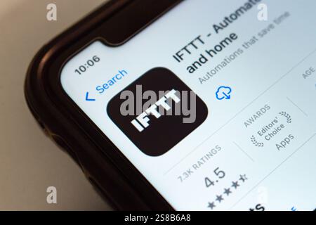 IFTTT app is displayed on App Store. IFTTT (acronym of If This Then That) is a tool that connects various apps and devices to automate tasks easily Stock Photo