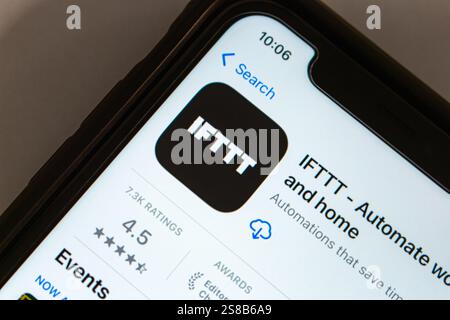 IFTTT app is displayed on App Store. IFTTT (acronym of If This Then That) is a tool that connects various apps and devices to automate tasks easily Stock Photo