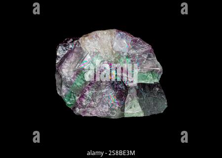 Natural rough rainbow fluorite gemstone on dark background Stock Photo