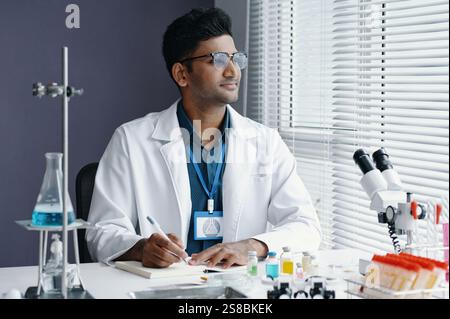 Scientist Analyzing Samples in Modern Laboratory Setting Stock Photo