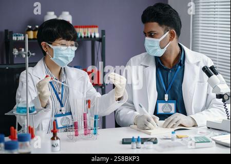 Conducting Scientific Research in Modern Laboratory Setting Stock Photo