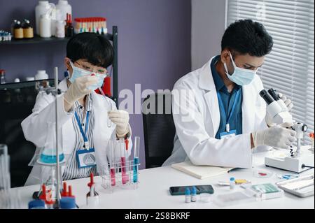 Researchers Studying Samples in Laboratory Setting Stock Photo