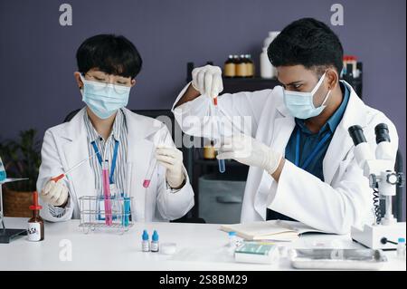 Conducting Scientific Experiments in Laboratory Environment Stock Photo