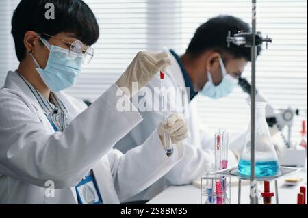 Scientists Conducting Experiments in Modern Laboratory Stock Photo