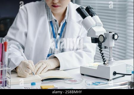 Conducting Scientific Research Using Laboratory Microscope Stock Photo
