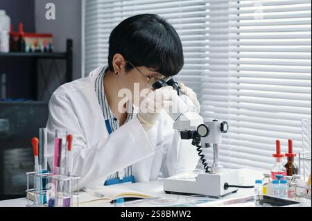 Researching Scientist Examining Samples in Laboratory Stock Photo