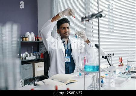 Conducting Scientific Experiments in Modern Laboratory Stock Photo