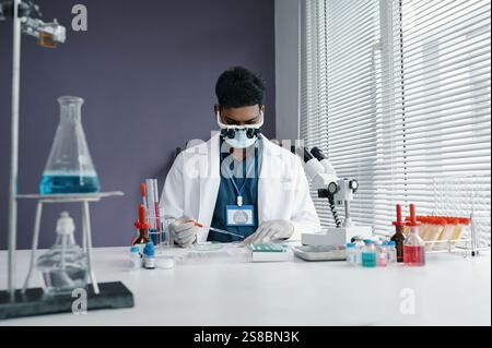 Conducting Scientific Experiments in Modern Laboratory Stock Photo