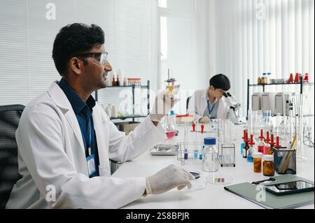 Scientists Conducting Experiments in a Modern Laboratory Stock Photo