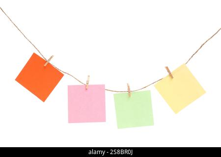 Different sticky notes, thread and clothespins isolated on white background Stock Photo