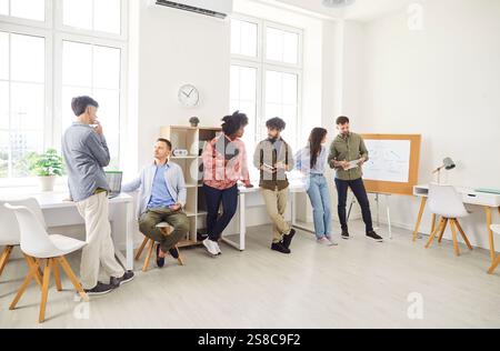 Business Team Discussing In Office During Meeting Or Training Stock Photo