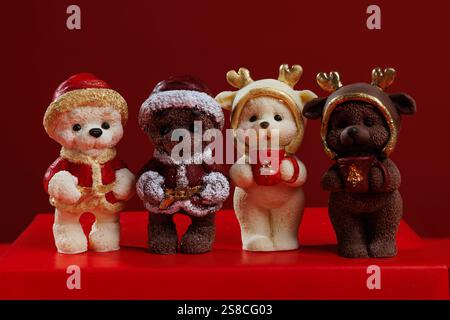 Different christmas chocolate figures on red background Stock Photo