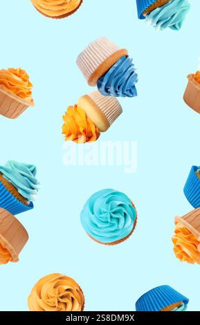 Pattern of cupcakes with bright cream on light blue background Stock Photo