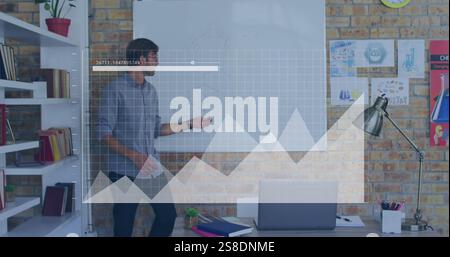 Image of statistics and data processing over caucasian male teacher Stock Photo