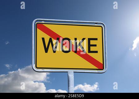Woke symbol image: The crossed-out term WOKE on a town exit sign (Composing) Stock Photo