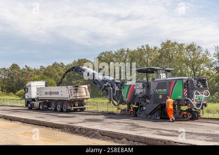 Removing asphalt from road surface preparing for resurfacing, Cottbus, Germany Stock Photo