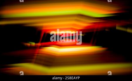 A captivating 3D render featuring a blurred tunnel-like structure with intense red and yellow gradients creating a sense of movement and depth. Stock Photo
