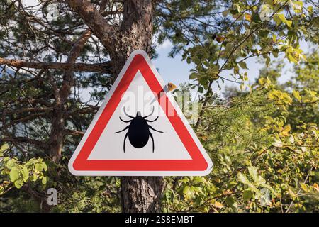 Infested Area. Sign Tick Infected area with danger sign. Risk of tick-borne and lyme ...