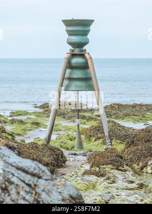 Time and Tide bell of St Patrick in Cemaes Bay, Anglesey, Wales Stock Photo
