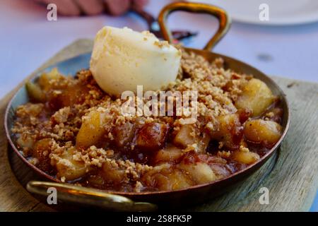 Apple Crisp Pie Dessert with Ice Cream and crumble Stock Photo