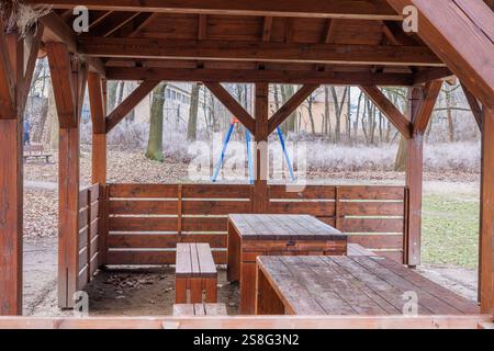 wooden benches with gazebo and tables in a park Stock Photo - Alamy