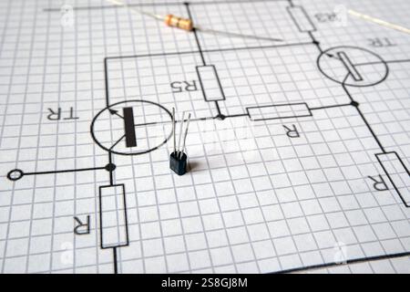 Transistor on the electronic circuit diagram. Stock Photo