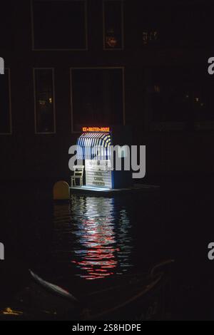 Floating artwork Ice Master Hous by Soyoun Kim at the Amsterdam Light Festival 2024-2025, in a canal in Amsterdam, The Netherlands Stock Photo