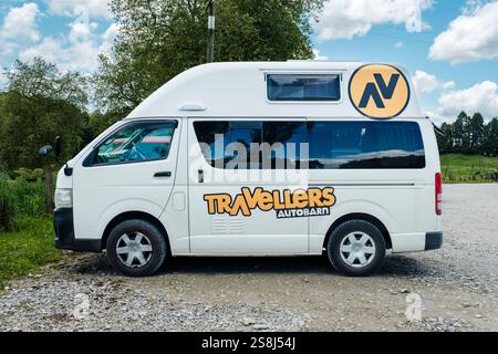Side view of a parked white Travellers Autobarn campervan used for independent road trips, New Zealand North Island, NZ Stock Photo