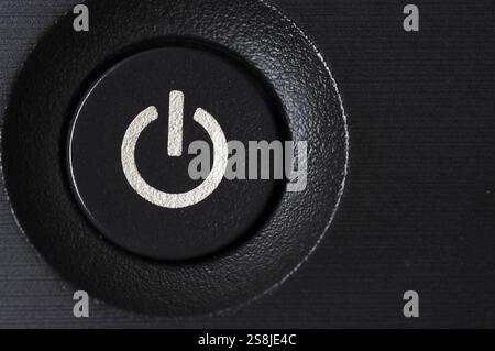 Close up of power button on electronic machine Stock Photo