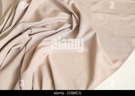 Beige tablecloth with folds on table, closeup Stock Photo