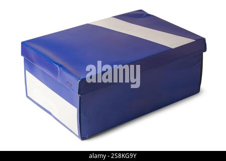 close-up of blue rectangular cardboard box or shoe box isolated white background, blank label on one side, mock-up template Stock Photo