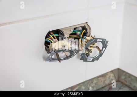 Fixing and repairing broken outlets and socket with tools and ammeter Stock Photo
