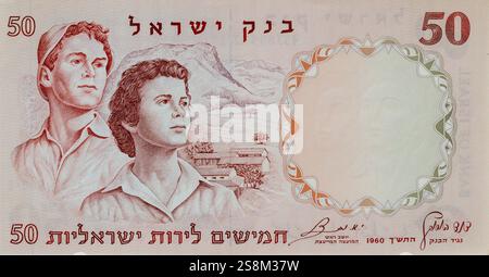 1960 Currency of Israel: Fifty Israeli Pounds Bank of Israel Second Issue Front. Two young pioneers against a background of an agricultural settlement Stock Photo