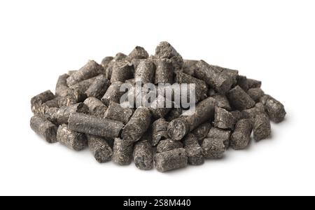 Pile of sunflower press cake pellets isolated on white Stock Photo
