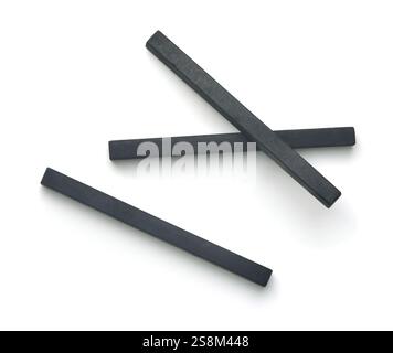 Top view of compressed charcoal drawing sticks isolated on white Stock Photo