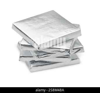 Stack of silver foil wrapped square chocolate bars isolated on white Stock Photo