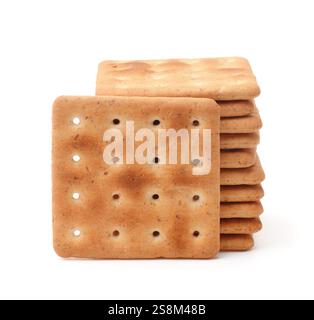 Stack of square wholegrain crackers isolated on white Stock Photo